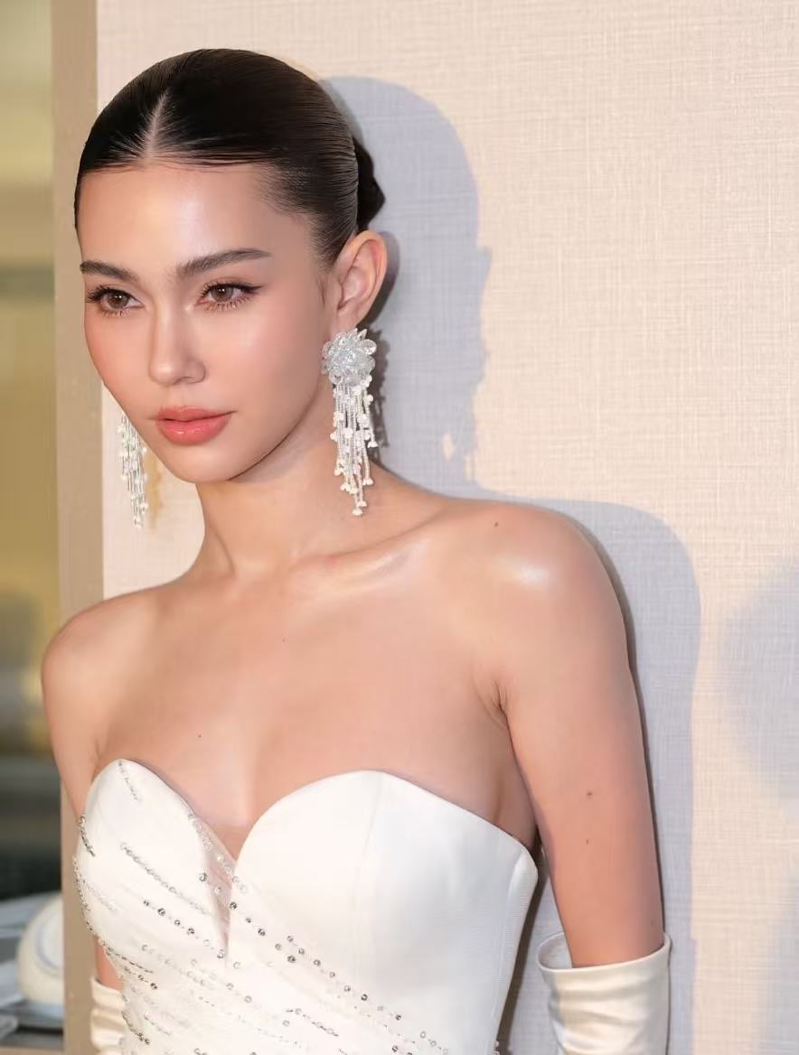 Elegant bridal portrait with sleek hair and dewy makeup